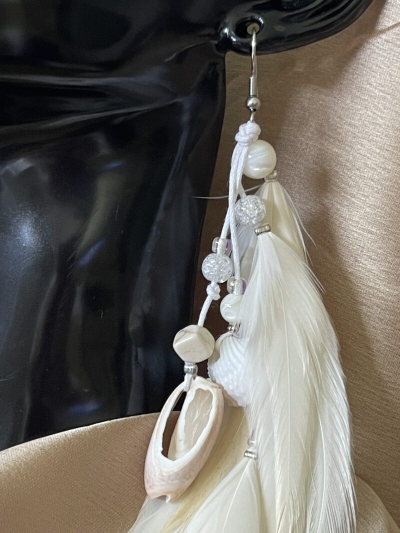 these are White Gypsy Feather Earrings – Bohemian Grace with Natural Elegance