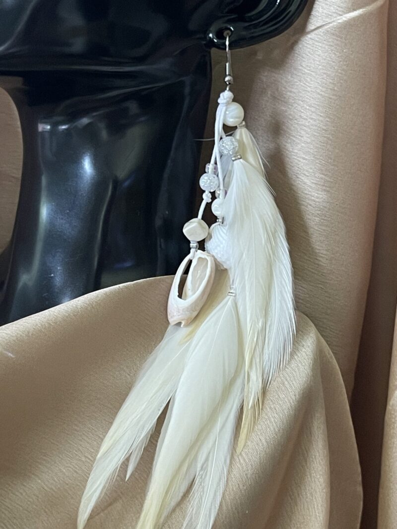 these are White Gypsy Feather Earrings – Bohemian Grace with Natural Elegance