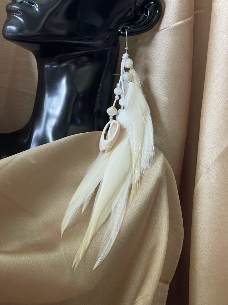 these are White Gypsy Feather Earrings – Bohemian Grace with Natural Elegance