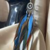 hese are Stunning Queen Blue Feather Earrings – Regal Elegance with a Bohemian Flair