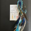 This is Turquoise Blue Brown Medium Feather Clip – Effortless Boho Elegance