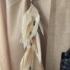 This is Long Magical Cream Feather Hair Clip – Enchanting Elegance for Your Hair