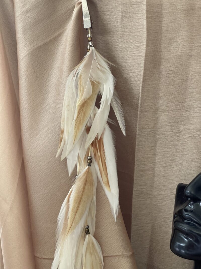 This is Long Magical Cream Feather Hair Clip – Enchanting Elegance for Your Hair