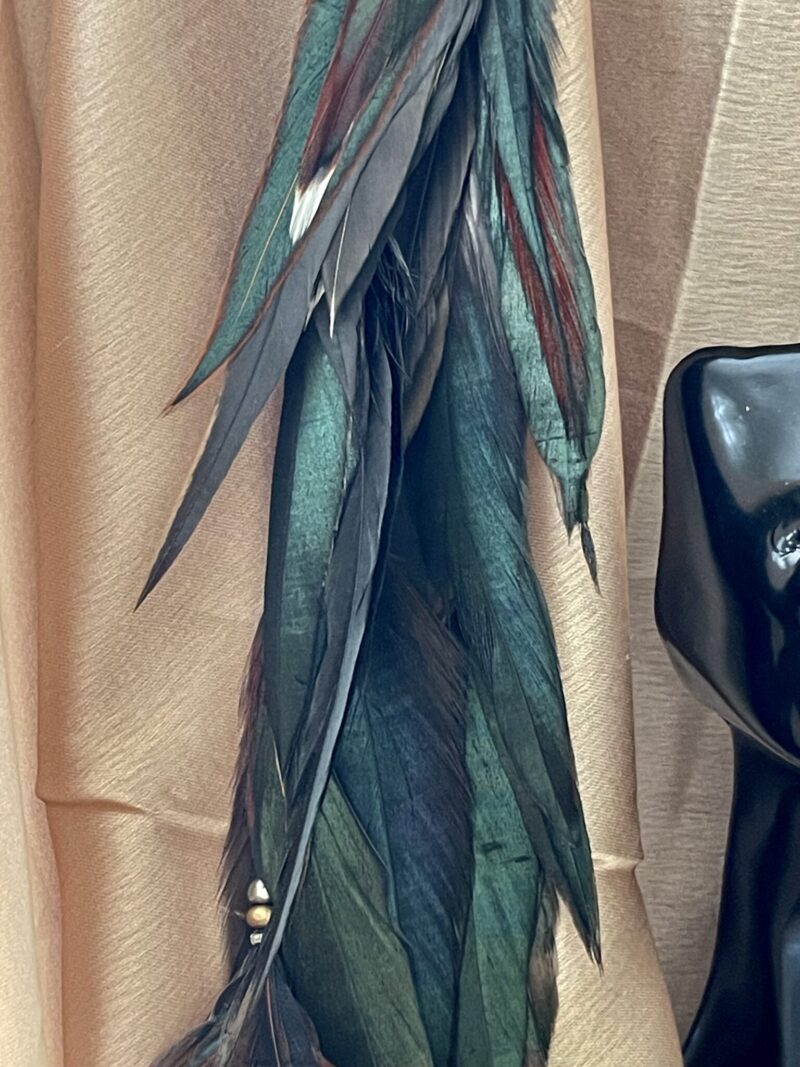 This is Dark Chocolate Forest Green Feather Clip – Natural Elegance with a Rustic Charm