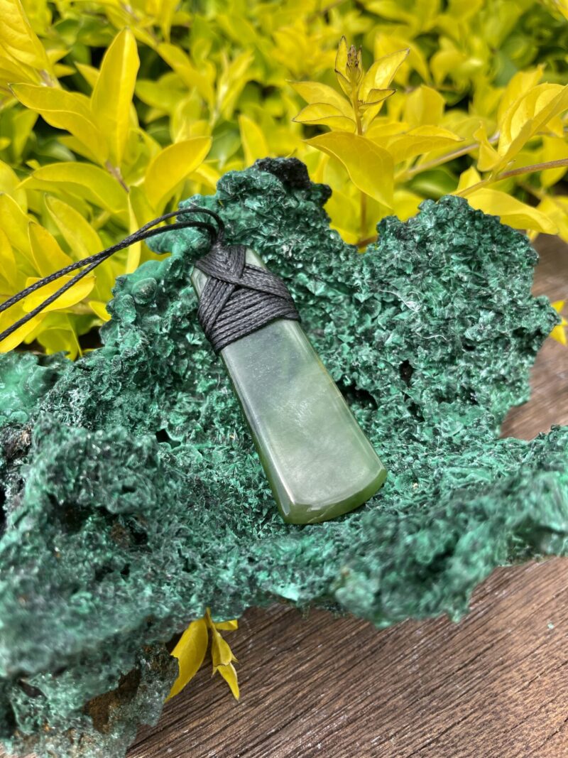 This is Elegant New Zealand Greenstone Pounamu Necklace with Black Cord – 7 x 2.5 cm