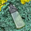 This is Elegant New Zealand Greenstone Pounamu Necklace with Black Cord – 7 x 2.5 cm