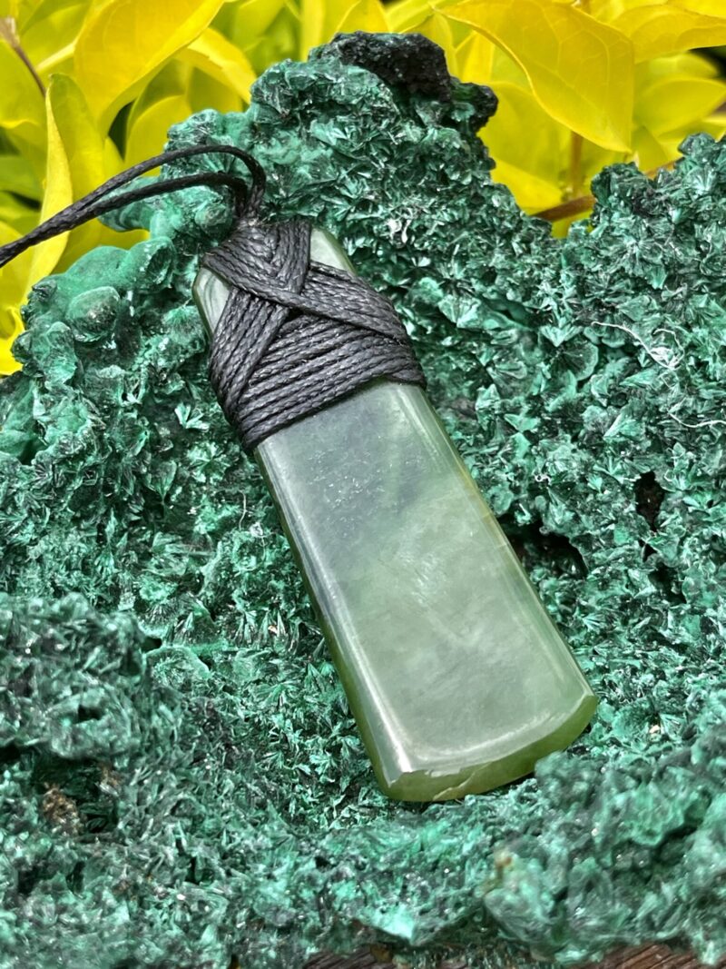 This is Elegant New Zealand Greenstone Pounamu Necklace with Black Cord – 7 x 2.5 cm