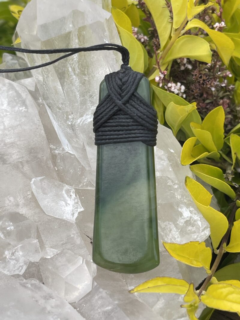 This is Elegant New Zealand Greenstone Pounamu Necklace with Black Cord – 7 x 2.5 cm