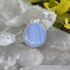 This is Timeless Elegance: Round Blue Lace Agate Pendant in Silver