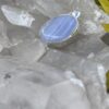 This is Timeless Elegance: Round Blue Lace Agate Pendant in Silver