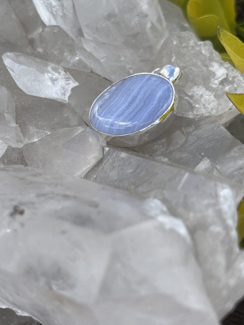 This is Timeless Elegance: Round Blue Lace Agate Pendant in Silver