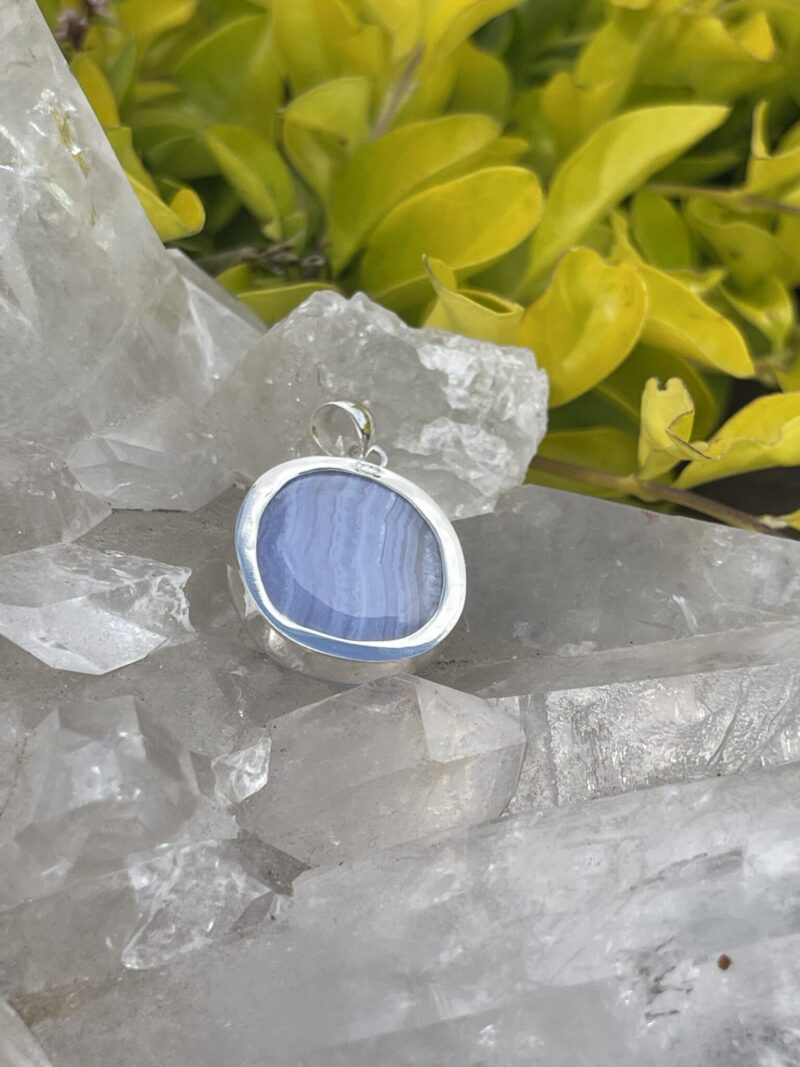 This is Timeless Elegance: Round Blue Lace Agate Pendant in Silver