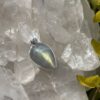 This is Mystical Charm: Small Labradorite Teardrop Pendant in Silver