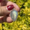 This is Mystical Charm: Small Labradorite Teardrop Pendant in Silver