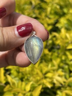 This is Mystical Charm: Small Labradorite Teardrop Pendant in Silver