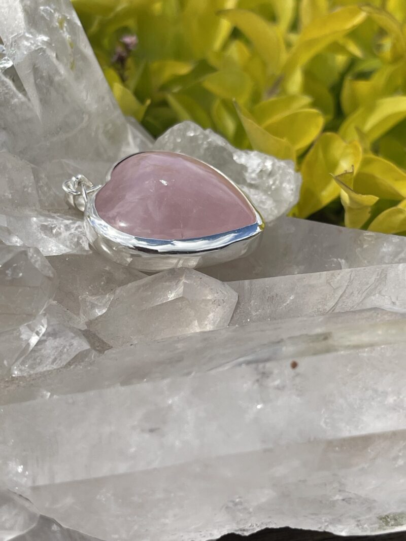 his is A Loving Embrace: Heart-Shaped Deep Rose Quartz Pendant in Silver