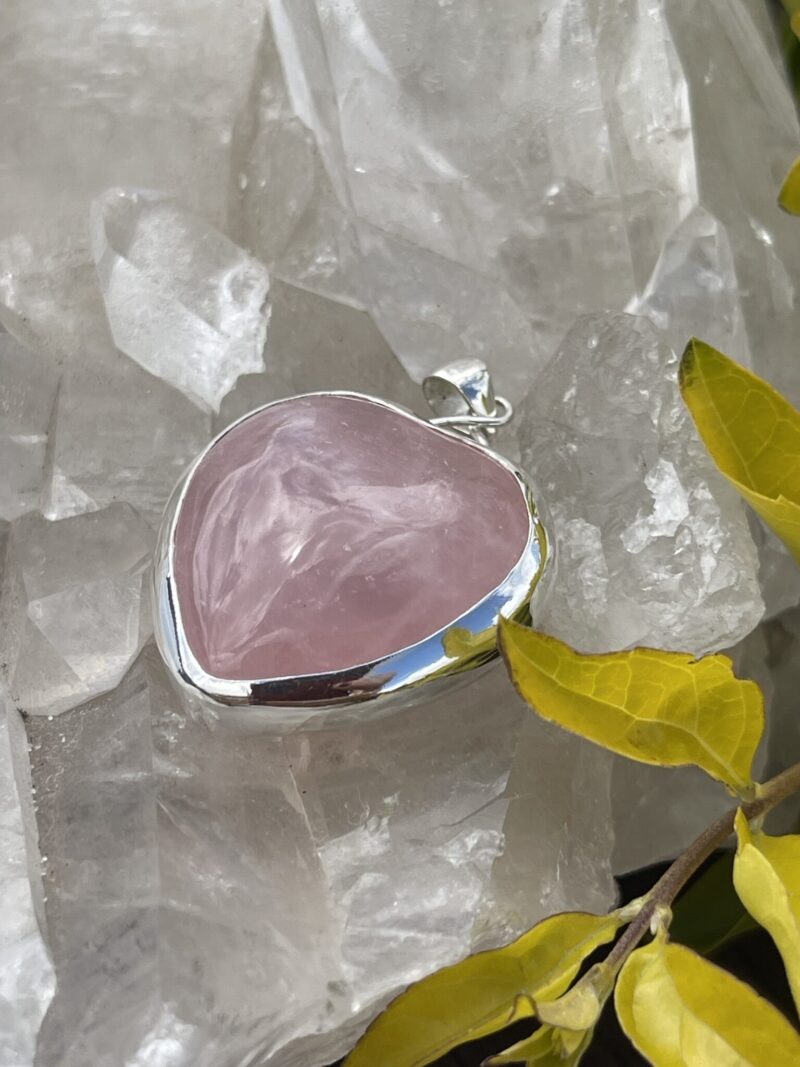 his is A Loving Embrace: Heart-Shaped Deep Rose Quartz Pendant in Silver