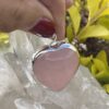 his is A Loving Embrace: Heart-Shaped Deep Rose Quartz Pendant in Silver