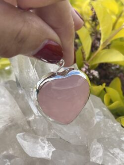 his is A Loving Embrace: Heart-Shaped Deep Rose Quartz Pendant in Silver