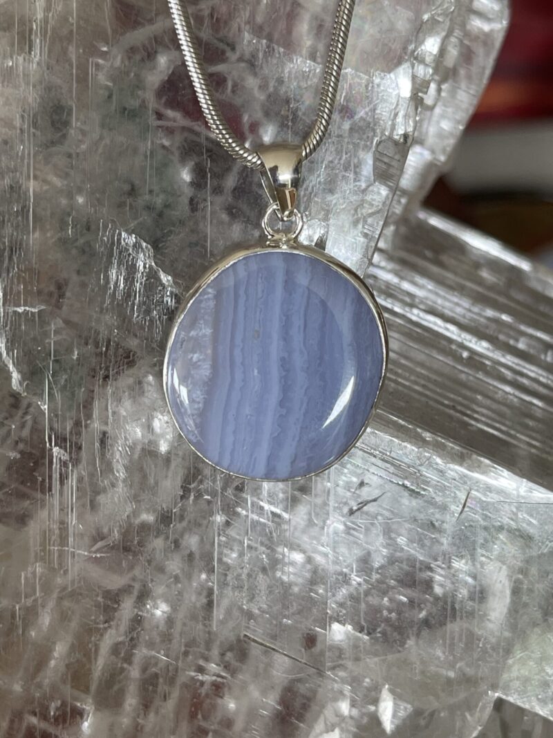 This is Timeless Elegance: Round Blue Lace Agate Pendant in Silver