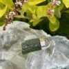 This is Verdant Moldavite Pendant in Silver M514 Verdant Light: Moldavite Pendant in Silver