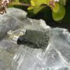 This is Radiant Moldavite Pendant in Silver M515 Radiant Transformation: Moldavite Pendant in Silver