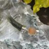 this is Moldavite Fire Opal Pendant in Silver MO524 Ignite Transformation: Moldavite and Fire Opal Pendant in Silver