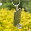 This is Moldavite Herkimer Diamond Pendant in Silver MH519 Stellar Brilliance: Moldavite and Herkimer Diamond Pendant in Silver