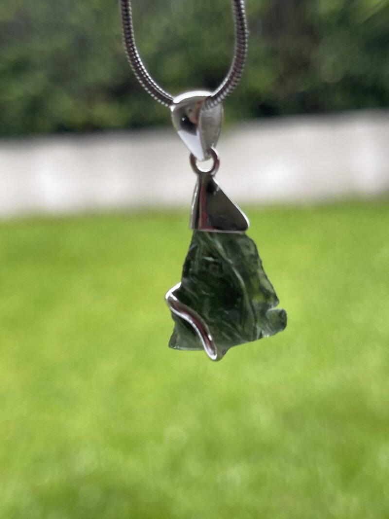 This is Transformational Glow: Moldavite Pendant in Silver M532