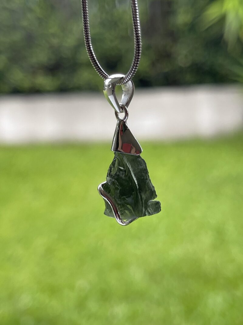 This is Transformational Glow: Moldavite Pendant in Silver M532