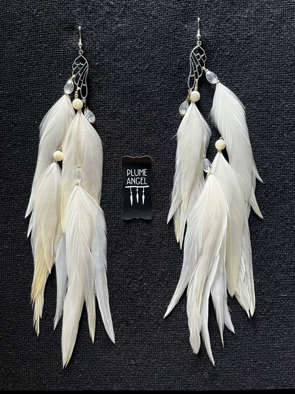 These are Butterfly White Feather Earrings – Graceful Elegance in Every Detail