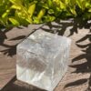 Grounding Brilliance: Rainbow Clear Quartz Cube (369g)